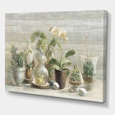 a painting of flowers and plants in vases on a table with an egg shell