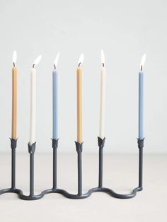 Our hand-forged wrought iron menorah is designed to hold nine of our Hanukkah Candles with elegant curves and tulip candle cups. Each menorah is entirely handmade using traditional methods—unique features and imperfections are to be celebrated. Gently press or pinch candle cups to secure candles as needed. Wipe clean with a soft cloth. 14” L x 2” W x 4” H Candles sold separately SKU: 1539-BMNH01 Bayberry Candles, Seeds Gifts, Tulip Candle, Hanukkah Candles, Candle Cups, Traditional Candles, Hanukkah Menorah, Selling Candles, Unique Features