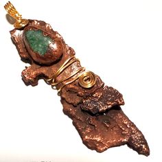 This Is Made With One Piece Of Tree Bark And 1 Jade Stone. Both Have Gone Through The Electroforming Process Coating Them With A Layer Of Copper, Patina Was Added For Extra Color Before Being Wire Wrapped With Gold Wire. Measurements: 90x24mm. Copper Electroformed Jewelry, Black Obsidian Necklace, Insect Necklace, Earth Jewelry, Copper Tree, Earth Green, Black Tourmaline Necklace, Obsidian Necklace, Tree Jewelry