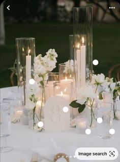 Modern Spring Wedding Decor, Wedding Side Table Ideas, Tall Candle Centerpieces, Dainty Wedding Centerpieces, Chic Wedding Table Decor, Center Peices, Tables For Wedding Reception, Champagne Wedding Table, Tall White Floral Centerpieces Wedding