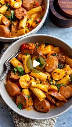 two bowls filled with pasta and sausage