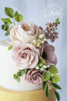 a close up of a cake with flowers on it