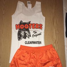 New Hooters Girl Vintage Original Uniform Shorts/Tank From The Original Hooters In Clearwater Florida. Size Tank-Xs And Shorts-Xxxs. Makes A Great Halloween Costume White Cotton Cheerleading Bottoms, White Cotton Bottoms For Cheerleading, White Summer Tank Top For Workout, White Summer Workout Tank Top, White Cheerleading Shorts For Summer, White Summer Cheerleading Shorts, White Short Tops For Streetwear, White Short Tank Top For Spring, Hooters Girl Costume