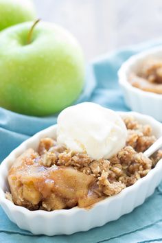 two small bowls filled with apple crisp and ice cream