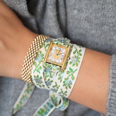 Our 2nd and Final Garden Party Vintage Wrap Watch features a vintage Must De Cartier Tank Quartz Watch circa the 1990s, reimagined with a feminine brocade ribbon designed to be wrapped multiple times around the wrist and tied off for a truly one of a kind look. This watch comes with both the blue/green ribbon AND the black/pink ribbon. Sterling Silver base with gold plating. Highly unique mixed metal Trinity Dial. Quartz Movement. Sold as is, plating has wear on the dial that adds to the piece's Vintage Fine Jewelry, Cartier Tank, Ribbon Design, Green Ribbon, Curated Vintage, The 1990s, Wrap Watch, Pink Ribbon, Estate Jewelry