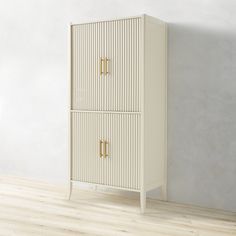 a white cabinet sitting on top of a hard wood floor