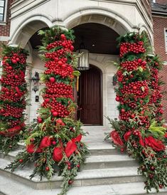 christmas decorations on the front steps of a building