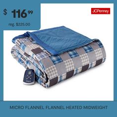 a blue and gray plaid blanket with a remote control on the side next to it