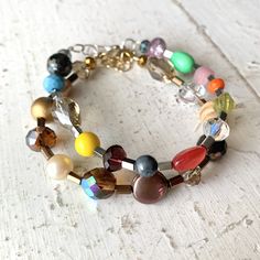 Beaded Bracelet filled with Vintage & New Inclusions in your color choice of Rainbow or Warm Neutrals. The colorful Rainbow option features silver metal spacer beads for a bit of light reflecting sparkle, while the Warm Neutrals option uses bronzy metals. Each one is an absolute One of a Kind filled with beads from yesterday and today! The bracelets measure about 7 1/4- 7 1/2 inches with an extra inch via a tonal extender chain for adjustable wear with a plated lobster clasp closure.  Stand out Multi-strand Bracelets With Colorful Beads For Jewelry Making, Multicolor Multi-strand Beaded Bracelets, Everyday Multicolor Beaded Chain Bracelets, Nickel Free Multi-strand Bracelets For Jewelry Making, Nickel-free Multi-strand Bracelets For Jewelry Making, Nickel Free Multicolor Beaded Bracelets, Multi-strand Czech Glass Bracelets As Gift, Nickel-free Multicolor Beaded Bangle Bracelets, Nickel-free Multicolor Beaded Bracelets