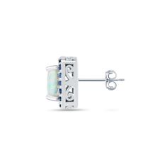 Enhance your look with these precious stud earrings. Sparkling cushion-cut white opal gemstones are set on a polished sterling silver frame surrounded by dazzling round blue sapphire gemstones creating a halo affect. It secures to the ear with post with friction backs. Product Details Metal Type sterling-silver Metal Stamp 925-sterling Weight 4.2GR Length 20.5MM Width 20.5MM Back Finding post-with-friction-back Stone Details Gem Type opal Number of Stones 2 Stone Color white Stone Shape cushion- Silver Cubic Zirconia Birthstone Earrings, Silver Birthstone Earrings With Cubic Zirconia, White Gold Sterling Silver Birthstone Earrings, White Diamond Birthstone Earrings, Fine Jewelry White Gold Birthstone Earrings, White Gold Birthstone Earrings Fine Jewelry, White Gold Diamond Earrings With Round Cut Gemstone, White Gold Diamond Earrings With Gemstones, White Gold Round Cut Diamond Earrings With Gemstone