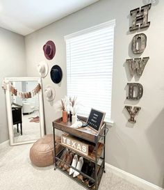 a room with hats on the wall and a mirror