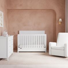 a baby's room with white furniture and pink walls