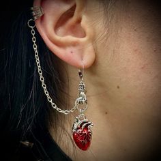 These vampire gothic earrings are the perfect accessory to style your dark side! One earring includes an anatomical heart with a chain that links to your ear. another earring represents a blood drop! Vampire Jewelry Earrings, Vampiric Jewelry, Vampire Piercing, Vampire Ears, Vampy Girl, Vampire Accessories, Vampire Earrings, Vampire Jewelry, Vampire Gothic