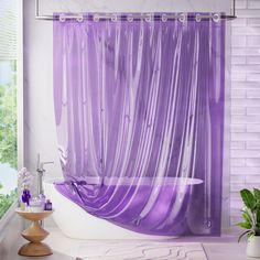 a purple shower curtain in a white bathroom