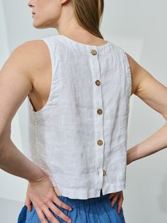 "Crop linen top buttoned at the back. Cropped length and large arm cutouts gives this sleeveless tank top lots of youthfulness while button fastening at the back and decorative hems turn this linen blouse into a solid preppy piece. No doubt, this crew-neck top would blend perfectly into almost any outfit. We boldly call it a must-have item for a woman on any age or style.  STYLE DETAILS * Regular fit * Crew neck * Large arm cutouts * Button fastening at the back * Crop length * French seams insi Linen Crop Top Outfit, Diy Linen Top, Linen Tops Women, Sleeveless Tops For Women, Linen Camisole, Linen Sleeveless Top, Loose Tank Top, White Linen Top, Linen Tops