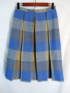 "I think this is the oldest GRAFF I've found! It's an early 1960s Vintage Graff Californiawear Women's Plaid Wool Skirt! Measured Size 28\" x 27\", Coarse Twill Weave in Blue, Brown, Tan Pleated, too! Gorgeous condition, near mint at the least. Smoke free! Measurements: Label size: None present Waist across: 14\" Hips across: \"free\" Length: 27\" Bottom hem across: 41.5\" Have a look at our other items. You won't believe what's coming up. Not kidding! PLEASE check the measurements as vintage cl Vintage Plaid Summer Skirt, 1940s Plaid Skirt, 1950s Plaid Skirt, Vintage Pleated Plaid Skirt, 60s Plaid Skirt, Plaid Wool Skirt, Wool Skirts, Wool Plaid, Best Jeans