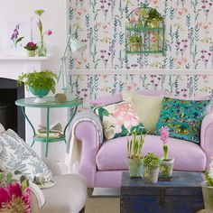 a living room filled with furniture and flowers