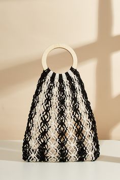 Step up your accessory game with the Black & White Stripe Open Knit Bag! Its contemporary design and striking monochrome pattern add a bold touch to any ensemble, making it the perfect statement piece. Product code: CAC12B4E002AC Features:  Material: 100%COTTON. Modern Black Woven Bag, Trendy Black Crochet Bag For Shopping, Modern Crochet Bag For Summer, Trendy Black Crochet Bag, Modern Black Shoulder Bag For Beach, Chic Black Crochet Bag For Shopping, Spring Shopping Black Crochet Bag, Black Crochet Bag For Shopping In Spring, Black Crochet Bag For Spring Shopping