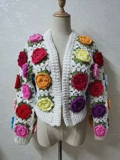 Step into the whimsical world of bohemian fashion with our Hand-Crocheted 3D Flower Ball Boho Cardigan. For the woman who adores unique fashion expressions, this cardigan is a testament to artistry. With its charming 3D floral patterns and loose-fit silhouette, it's the perfect blend of comfort and style, inviting you to embrace the artistic boho spirit during the enchanting autumn and winter. Specs: Material: Polyester Handmade Bohemian Spring Cardigan, Spring Patchwork Cardigan, Spring Crochet Acrylic Sweater, Spring Acrylic Crochet Sweater, Handmade Bohemian Sweater For Spring, Handmade Acrylic Cardigan For Spring, White Bohemian Sweater For Spring, Spring Trendy Hand Knitted Cardigan, Multicolor Hand Knitted Cardigan For Spring