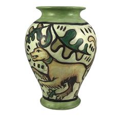 a ceramic vase with an animal design on the front and bottom, painted in green