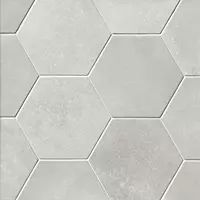 a white tiled wall with hexagonal tiles