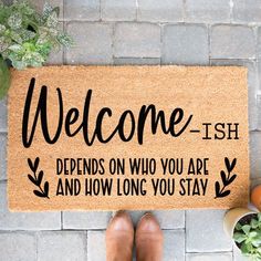 a welcome mat with the words,'welcome - fish defends who you are and how long you stay '