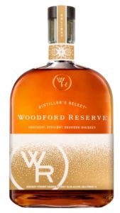 a bottle of woodford reserve whiskey on a white background with the label in gold foil