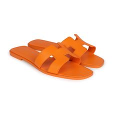 This pair of Oran sandals are in Orange Sunset epsom leather, H cutout detail, Natural leather insole, natural leather sole, in size 42 EU.Origin: ItalyCondition: New and never wornAccompanied by: Hermes box, dustbagsSize: 42 EU Classic Summer Calf Leather Slides, Luxury Summer Slides With Rubber Sole, Summer Slip-on Slides In Calf Leather, Summer Calf Leather Slip-on Slides, Modern Calf Leather Slides For Summer, Elegant Orange Beach Sandals, Orange Sandals With Rubber Sole For Spring, Spring Orange Sandals With Rubber Sole, Designer Leather Sole Beach Sandals