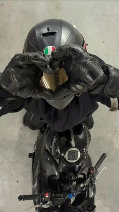 the helmet and gloves are attached to the motorcycle