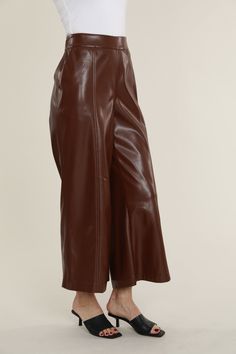 If you’re looking to merge fashion and comfort, our Faux Leather Wide Leg Crop Pants are a trendy yet versatile option. Perfect for both everyday outings and sophisticated events, these cropped wide leg leather pants can be paired with a basic tee or a glam top, as well as any type of footwear⁠—from casual loafers to elegant heels. Made of premium vegan leather, these pants feature a high-waisted, wide-leg silhouette and a cropped length for a modern and chic look that elevates day-to-day dressi Wide Leg Leather Pants, Capri Pants Outfits, Glam Tops, Wide Leg Crop Pants, Elegant Heels, Wide Leg Cropped Pants, Casual Loafers, Crop Pants, Work Clothes