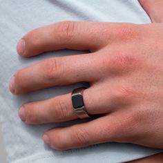 a person wearing a ring on their left hand