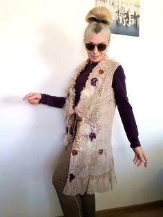 I designed and constructed this M size beige sleeveless cardigan.This boho chic vest can be worn every day or when you want to feel good and one of a kind.Length - 89 cm/ 35 inches Bust - 102 cm/ 40 inchesHips - 107 cm/ 42 inchesI used beige knit cotton blend sleeveless cardigan, laces,velvet,tulle,Preciosa glass beads, sequins..This embroidered fleece jacket is NOT STRETCHY !!!! Floral Spring Cardigan M Embroidered Knit Vest Machine wash on a gentle or wool program!!!!All my items are ready to ship within 1-3 working days. You will receive them in a special box or an envelope/protected with bubble wrap material inside/ of the Bulgarian National Post.I also add a special gift bag, handmade by me.This knit casual cardigan jacket is exclusive, one of a kind, because I don`t make more than on Sleeveless Beige Cardigan For Fall, Beige Sleeveless Cardigan For Fall, Bohemian Spring Vest For Layering, Bohemian Vest For Spring Layering, Bohemian Vest For Fall Layering, Sleeveless Beige Cardigan Vest, Beige Sleeveless Vest Cardigan, Bohemian V-neck Vest For Spring, Handmade Bohemian Vest For Spring