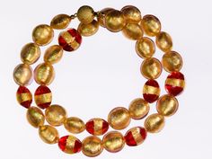 Gold and Red 24K Gold Leaf Murano Glass Necklace Formal Gold Necklace With Large Beads, Formal Gold Necklaces With Large Beads, Gold Necklaces With Large Beads For Formal Occasions, Gold Glass Jewelry For Celebration, Celebration Gold Glass Jewelry, Gold Beaded Necklace For Formal Occasions, Gold Necklace With Large Glass Beads, Gold Round Beaded Necklaces For Celebration, Gold Glass Single Strand Beaded Necklace