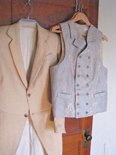 "Note: We can make all types of frock coats and vests. Just contact us if you have a different style in mind. ------------------------------------------------------------ This listing is for a 3-Piece suit with an Edwardian style frock coat, made from a genuine vintage pattern. The jacket and the pants are made from a wheat colored linen and the double breasted vest is made from a stunning brocade. The frock coat is a gently cut-away front morning coat with two buttons and longer narrow lapels. Fitted Spring Suit With Vest, Sleeveless Vest With Buttons For Wedding, Elegant Fitted Vest With Pockets, Fitted Vest With Buttons For Wedding, Fitted Wedding Vest With Buttons, Fitted Cotton Nehru Jacket For Semi-formal Occasions, Fitted Semi-formal Outerwear Vest, Elegant Cotton Nehru Jacket For Semi-formal Occasions, Elegant Cotton Nehru Jacket For Formal Occasions