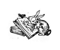 the rabbit is sitting on top of an open book