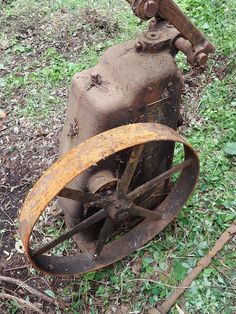 an old propane gas tank sitting in the grass