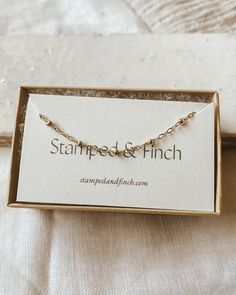 This dainty choker necklace is lovely on its own or layered with other necklaces -Non-tarnish, hypoallergenic 14 Karat Gold Filled All designs and photos owned by Stamped and Finch, LLC. Dainty Adjustable Layered Necklace As Gift, Delicate Adjustable Layered Necklace For Gift, Adjustable Delicate Chain Choker As Gift, Dainty Charm Necklaces With Tiny Beads For Gift, Delicate Layered Necklace With Satellite Chain For Gift, Dainty Layered Choker Necklace For Gift, Dainty Layered Choker Necklace As Gift, Minimalist Adjustable Layered Necklace For Gift, Dainty Adjustable Charm Necklaces With Satellite Chain