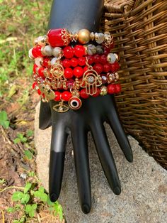 Red Bead Bracelet Set Featuring Good Luck Charms  Handmade with high quality beads and charms. Bracelets are stackable and can be worn together or individually.  This 6pc set includes Elephant, Hamsa, and Evil Eye Charms.  Fits most wrist. Color: Red and gold plating.  Size: stretch to fit Fact: Looks really good on your wrist😘 Broncos Bracelet, Red Bead Bracelet, Bracelets With Charms, Stacked Bracelets, Red Charm, Red Beaded Bracelet, Charms Bracelets, Luck Charm, Bead Bangles