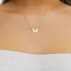 Hearts will flutter at the sight of the mini plain butterfly necklace. This butterfly-shaped pendant is fixed to a delicate chain, creating an effortlessly charming necklace. Add a dose of whimsy to your necklace stack, or wear it on its own for a simply sweet look. Dainty Yellow Gold Butterfly Necklace With Clavicle Chain, Minimalist Butterfly Necklace For Everyday, Dainty 14k Gold Butterfly Necklace With Charm, Minimalist Yellow Gold Butterfly Necklace, Minimalist Everyday Butterfly Necklace, Everyday Minimalist Butterfly Necklace, Dainty Butterfly Charm Necklace With Clavicle Chain, Dainty Butterfly Charm Necklace With Delicate Chain, Dainty Everyday Jewelry With Butterfly Charm