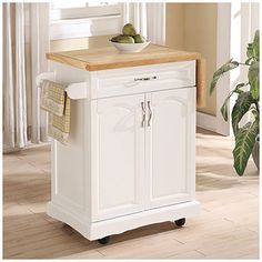 a white kitchen island cart with wooden top