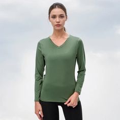 Fall Sports V-neck Tops, Solid V-neck Athleisure Top, Sporty V-neck T-shirt For Fall, Athleisure V-neck Tops For Fall, Fall V-neck Athleisure Tops, Sporty Green V-neck T-shirt, Green V-neck T-shirt For Fall, Solid Color V-neck Athleisure Top, Athleisure V-neck T-shirt In Solid Color