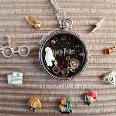 a harry potter pocket watch surrounded by charms