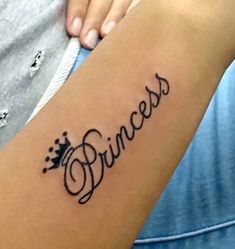 a woman's arm with the word princess tattooed on it