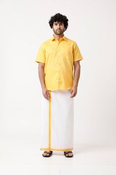 Elevate your traditional wardrobe with our Shirt Matching Fancy Border Single Dhoti Sets for Men. This elegant set features a stylish shirt paired with a beautifully designed dhoti, perfect for special occasions and cultural events. Add sophistication and charm to your ensemble with this exquisite outfit. Material: Cotton Rich Blend Fit: Smart Fit Sleeve: Half Sleeve Dhoti Type: Fancy Border Single Dhoti (2 meters) Colors: Yellow, Orange, Ramar Blue, Maroon, Navy Blue Design Type: Solid Wash Care: Machine Wash Disclaimer: Product color may slightly vary due to photographic lighting sources or monitor/screen settings. Men Premium Cotton Matching Shirt & Dhoti Set - Half Sleeves - Fancy Border - Without Pocket/loop closure Feel comfort and tradition by wearing this premium cotton matching dh Traditional Short Sleeve Tops For Eid, Traditional Cotton Shirt For Festive Season, Short Sleeve Traditional Wear For Eid, Traditional Cotton Shirt For Eid, Traditional Wear With Pallu For Festivals, Traditional Short Sleeve Kurta For Navratri, Traditional Fit Sets For Puja And Festivals, Classic Cotton Sets For Festive Occasions, Classic Cotton Festive Sets