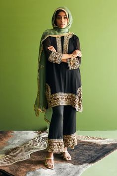 Black kurta with zardozi, floral embroidered placket and sleeve hem. Paired with pant and dupatta.
Component: 3
Pattern: Embroidery
Type Of Work: Zardozi, floral
Neckline: Round
Sleeve Type: Long sleeves
Fabric: Georgette, Organza
Color: Black
Other Details: 
Contrast dupatta
Tassel fringe bordered dupatta
Embroidery on pant hem
Side slit
Occasion: Sangeet - Aza Fashions Embroidery Zardozi, Contrast Dupatta, Dupatta Embroidery, Black Kurta, Beef Empanadas, Kurta Set For Women, Luxury Sale, Pattern Embroidery, Fashion App