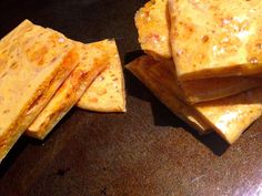 several pieces of food sitting on top of a table