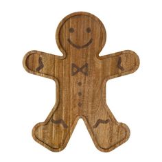 a wooden cutout of a smiling ginger