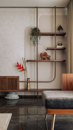 a living room filled with furniture and a book shelf next to a wall mounted air conditioner