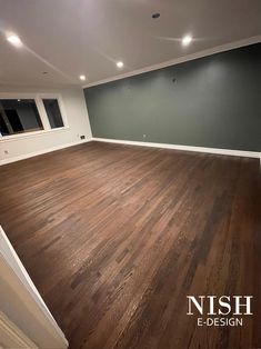 an empty room with hard wood flooring and white trim on the walls is shown