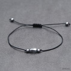 Simple and elegant Tiny black adjustable bracelet you'll never want to take off!  Who wouldn't want to add this meaningful piece to their wrist? Hematite will help you find calmness and transform an excited mind into a calm and clear mind when you need it. It is a memory enhancer and an aid to clarity of thought and control of stress.  It is a "mind cleanser" and will aid in calming emotions to allow for rational thought and decision making. Wear the bracelet on its own for a more laid-back feel Minimalist Silver Braided Resizable Bracelet, Minimalist Silver Resizable Braided Bracelet, Silver Minimalist Resizable Braided Bracelet, Minimalist Resizable Silver Braided Bracelet, Adjustable Minimalist Hematite Jewelry, Adjustable Minimalist Gunmetal Bracelet, Gunmetal Adjustable Minimalist Jewelry, Gunmetal Minimalist Adjustable Jewelry, Adjustable Gunmetal Bracelet For Everyday